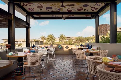 a restaurant with tables and chairs and a large window at Zadún, a Ritz-Carlton Reserve, Los Cabos in San José del Cabo