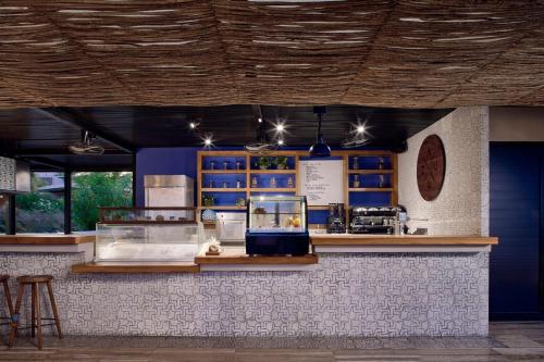 a restaurant with a counter with some items on display at Zadún, a Ritz-Carlton Reserve, Los Cabos in San José del Cabo