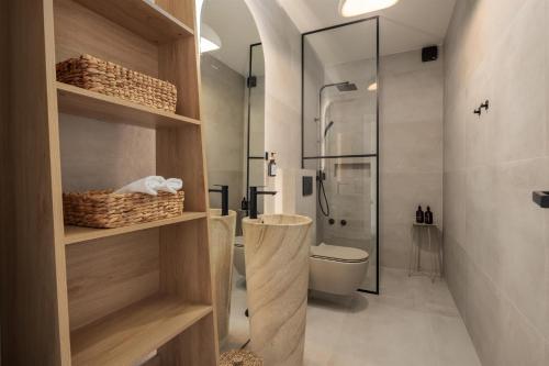 a bathroom with a shower and a toilet in it at Villa Sea Song in Tkon