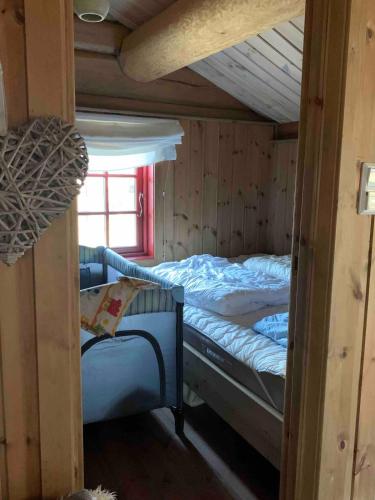 a bedroom with a bunk bed in a cabin at Holiday cabin, Kristianplass at Bjorli, Lesja in Bjorli
