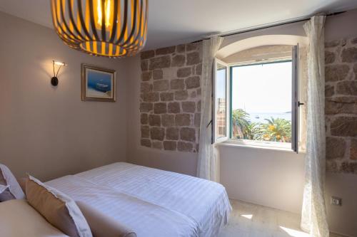 Postel nebo postele na pokoji v ubytování Heritage Hotel Park Hvar