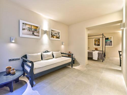 a living room with a couch and a table at Pezoules House in Lefkes
