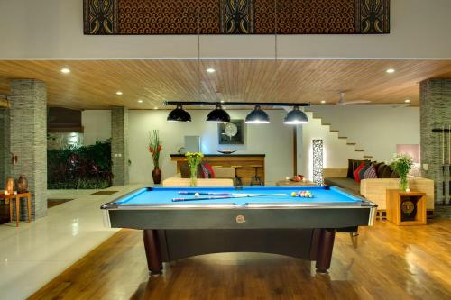 a pool table in the middle of a living room at Villa Kinaree Estate in Seminyak