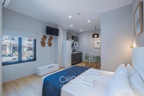 Postel nebo postele na pokoji v ubytování CORAL ZAHARA Suites by Cadiz4Rentals