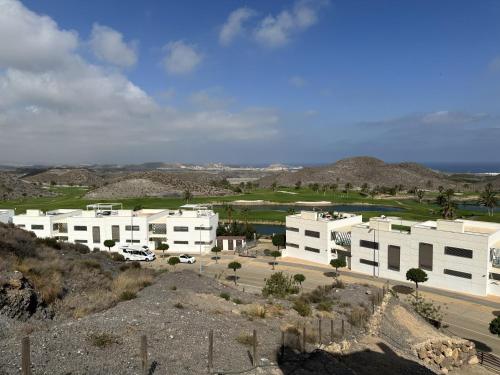 a group of white buildings on top of a hill at Casita San Juan in Pilar de Jaravía