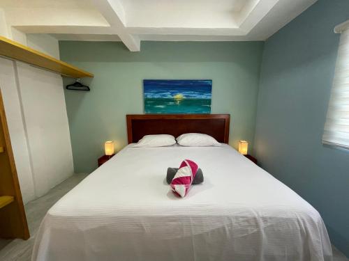 Una cama o camas en una habitación de Casona Suites