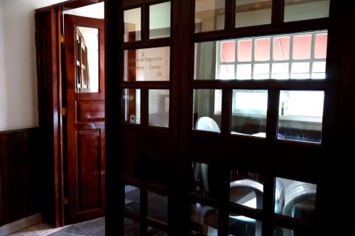 an open door with a view of a room at Hotel Boutique AB in Momoxpan