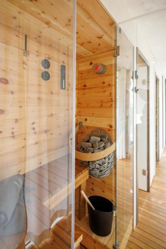 a wooden cabin with a glass wall at NIDO by PATIO in Berlin