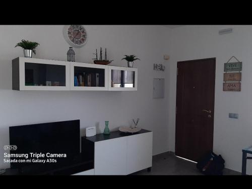 Televízia a/alebo spoločenská miestnosť v ubytovaní Merlo's Gaviotas. (Apartamento).