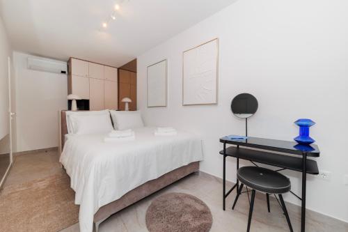 Ένα ή περισσότερα κρεβάτια σε δωμάτιο στο Stars Premium Apartment by Belmont Realty