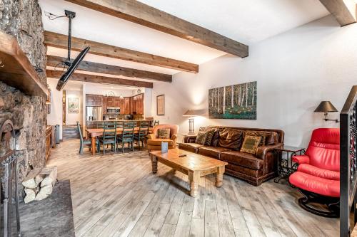 a living room with a couch and a table at Beaver Creek West Mountain Condo in Avon