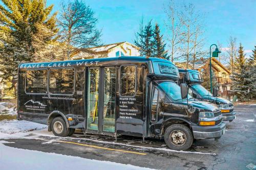 a row of buses parked in a parking lot at Beaver Creek West Mountain Condo in Avon