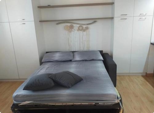 Ένα ή περισσότερα κρεβάτια σε δωμάτιο στο Loft modern minimal con terrazza in Salento
