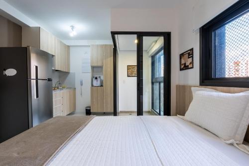 Postel nebo postele na pokoji v ubytování Alto Madalena - Studios de luxo com piscina panorâmica
