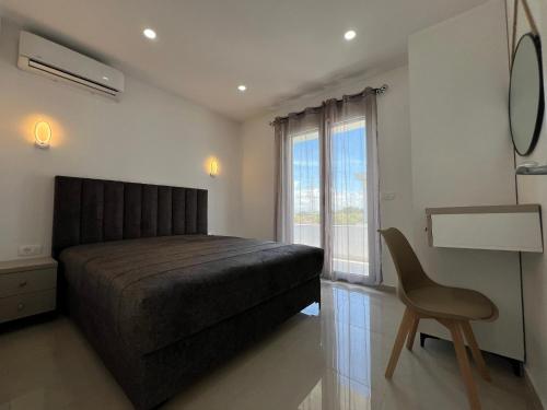 Postel nebo postele na pokoji v ubytování Apartments Bojku