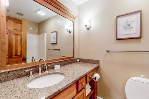 a bathroom with a sink and a toilet at Sunrise - Timberline-L5 in Killington