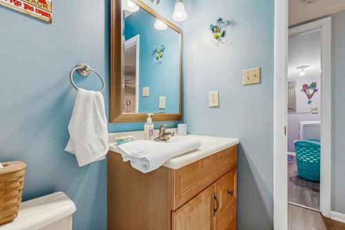 a bathroom with a sink and a mirror at Beach Retreat in Ocean City