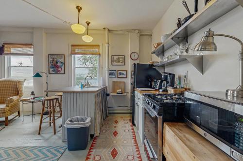a kitchen with a stove and a counter top at Sunrise on the Sheepscot in Wiscasset