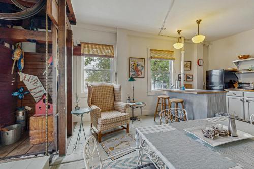a kitchen with a table and chairs in a room at Sunrise on the Sheepscot in Wiscasset
