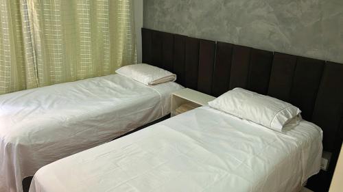Postel nebo postele na pokoji v ubytování PALACETE Linha Verde - FLORAMAR