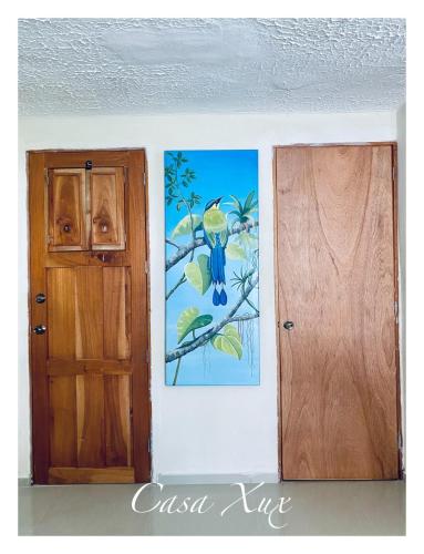 a room with a door and a painting on the wall at Cozy and Central Room in Mérida