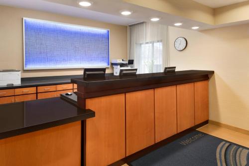 an office with a large screen on the wall at Fairfield Inn & Suites Minneapolis Bloomington/Mall of America in Bloomington