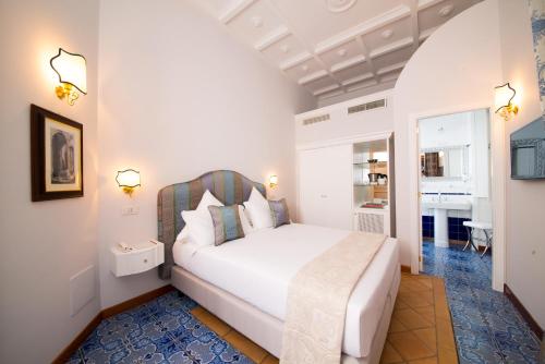 Postel nebo postele na pokoji v ubytování B&B Maiurè