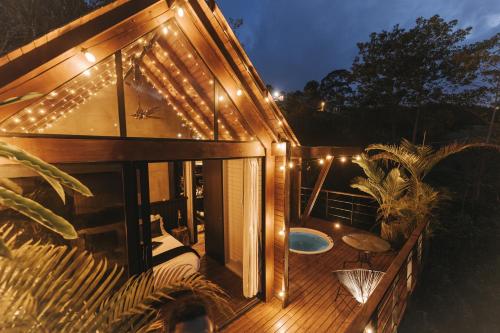 a house with a deck with lights on it at KABINE in El Peñol