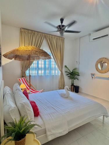 a bedroom with a large bed with an umbrella at ALOHA HOME Near KTCC,Mayang Mall, Pasar Payang in Gua Sai