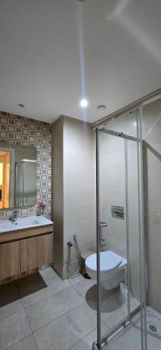 a bathroom with a tub and a sink and a toilet at Loft of joy La Soukra in La Soukra