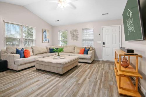 a living room with a couch and a table at Suite Carolina in Charleston