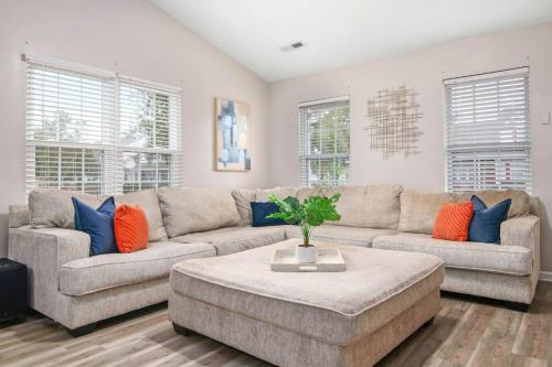 a living room with a couch and a table at Suite Carolina in Charleston