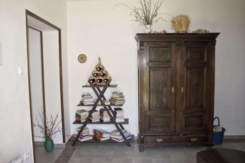 a christmas tree on a shelf next to a wooden cabinet at Penzion Albeř in Nová Bystřice