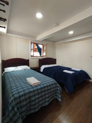 Ein Bett oder Betten in einem Zimmer der Unterkunft Hostal Casa Cotopaxi
