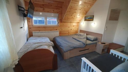 Postel nebo postele na pokoji v ubytování VIP Durmitor