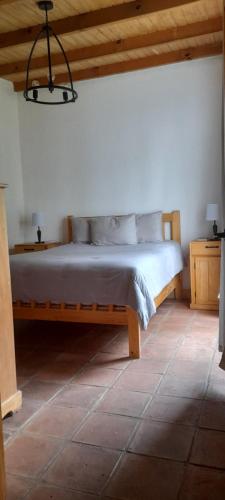 Ένα ή περισσότερα κρεβάτια σε δωμάτιο στο Cabaña El Colibrí