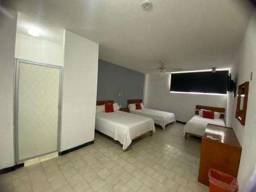 Postel nebo postele na pokoji v ubytování Hotel Italia, Aguascalientes