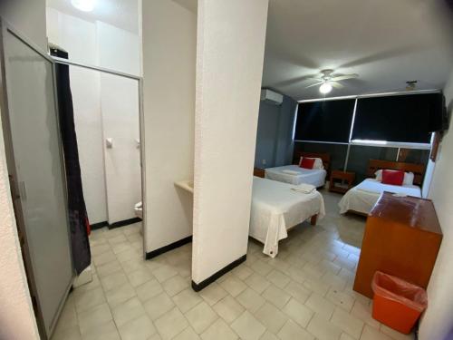Postel nebo postele na pokoji v ubytování Hotel Italia, Aguascalientes
