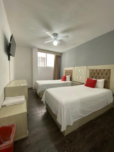 Postel nebo postele na pokoji v ubytování Hotel Italia, Aguascalientes
