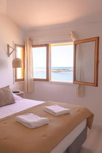 Katil atau katil-katil dalam bilik di Apartamentos Alborada