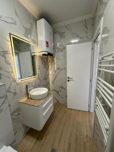a bathroom with a sink and a mirror at Bellanti in Herceg-Novi