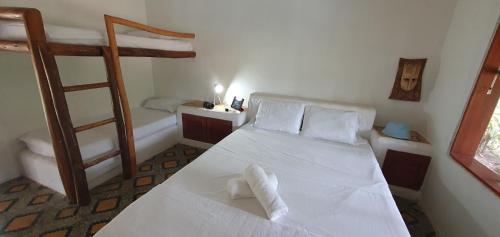 a bedroom with two bunk beds and a ladder at Las Palmas - Espectacular casa a borde de lago con piscina in Prado