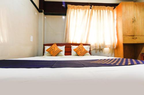 Katil atau katil-katil dalam bilik di Hotel O S President