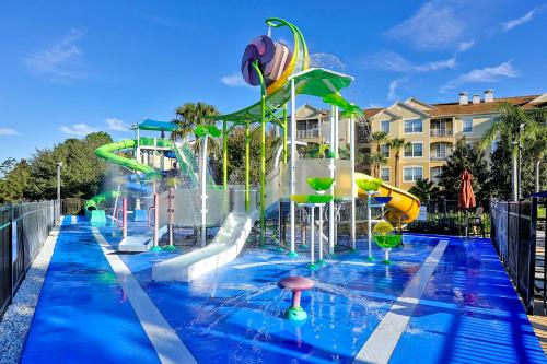 a pool with a water park with a water slide at Summer is Calling - Disney Close - No Resort Fees in Orlando
