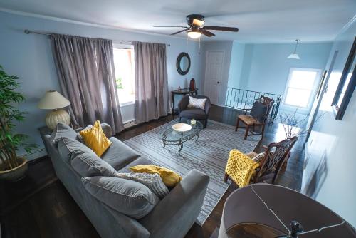 a living room with a couch and a table at Abundant Seed in Rosedale