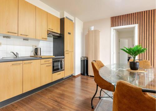 a kitchen with a table with a potted plant on it at The Stalle in Brussels
