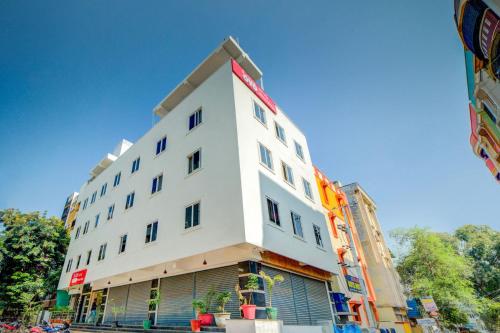 a white building with a lot of windows at Hotel O White Ridge in Hyderabad