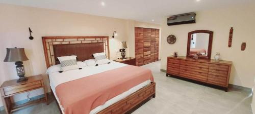 Ένα ή περισσότερα κρεβάτια σε δωμάτιο στο Naisári Residencia Punta de Mita San Andrés