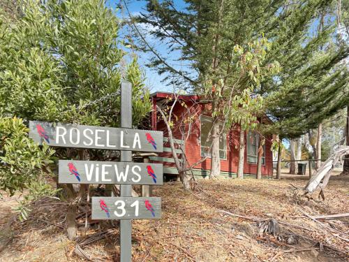 a street sign in front of a house at Rosella Views in Mount Buller