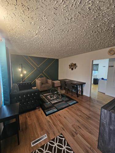 a living room with a couch and a table at Aansel Suites 2 bedroom in Edmonton